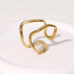Modern luxury fine art editorial jewelry fluid gold wire ring gift for her.