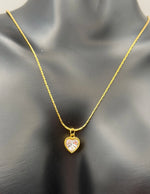 Vintage beaded edge tiny cubic zirconia heart necklace.