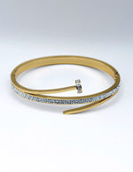 Hypoallergenic gold plated pavé nail motif bangle architectural jewelry.