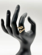 18K gold plated fluted white enamel bypass ring by Biya Accessoires.