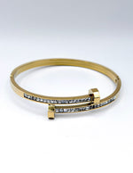 Waterproof gold bypass bangle with baguette crystals Biya Accessoires UAE.