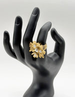 Waterproof gold large pearl coral statement ring on wood Dubai.