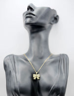 18K gold plated pavé crystal bow necklace by Biya Accessoires.