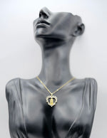 Biya Accessoires sacred heart medallion necklace with 18K gold plating and crystals.