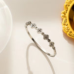 silver plated crystal clover station bangle by Biya Accessoires.