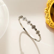 silver plated crystal clover station bangle by Biya Accessoires.