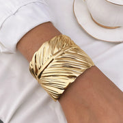 Waterproof 18K gold sculptural leaf cuff bracelet Biya Accessoires UAE.