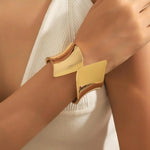 Waterproof 18K gold wide flared statement cuff Biya Accessoires UAE.