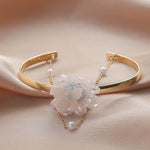 Waterproof 18K gold layered pearl and butterfly bangle Biya Accessoires UAE.