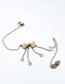 18K gold dainty butterfly tassel bracelet by Biya Accessoires.