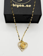 Hypoallergenic non-tarnish gold chain necklace with rose centerpiece.