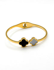 Gold bracelet with clover-shaped ends on a white background gift for her