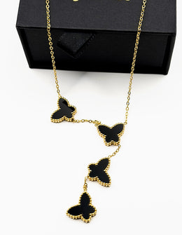 18K gold plated black butterfly lariat necklace by Biya Accessoires.