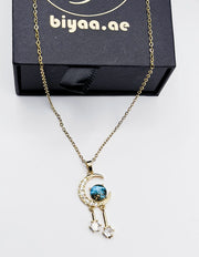 Premium quiet luxury blue sandstone moon necklace UAE.