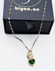 Waterproof vintage royal heart gold jewelry on silk background.