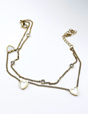 18K gold plated double chain pearlescent heart bracelet by Biya Accessoires.