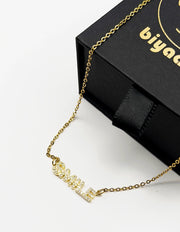Waterproof gold smile word pendant on silk Dubai.
