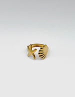 18K gold plated sculptural shell and starfish bypass ring by Biya Accessoires.