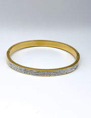 Hypoallergenic non-tarnish high polish gold rigid crystal bangle UAE.
