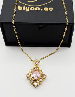 Waterproof gold royal pink gemstone style necklace on silk.