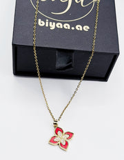 18K gold plated red quatrefoil clover pendant necklace by Biya Accessoires.
