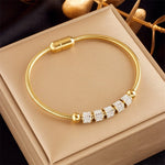 Hypoallergenic non-tarnish high polish gold crystal bangle UAE.