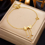 18K gold plated frosted butterfly and crystal fringe bracelet by Biya Accessoires.