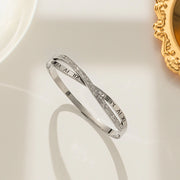 silver plated Roman numeral and crystal crossover bangle by Biya Accessoires.