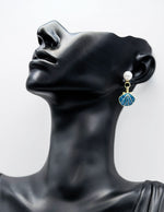 Everyday luxury fashion jewelry gold tone statement drops by Biya Accessoires Dubai.