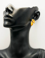 Best fashion jewelry in UAE botanical leaf earrings with emerald brown enamel.