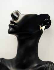 Biya Accessoires gold butterfly stud earrings with white enamel and crystals.