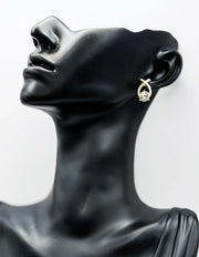 Close-up of premium hypoallergenic imitation jewelry featuring a large round crystal.