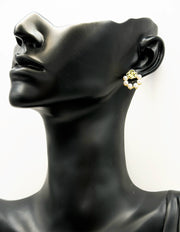 Elegant gold flower stud earrings with a faux pearl semi-circle.