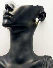 Close-up of premium hypoallergenic imitation jewelry featuring a dual band pearl stud.