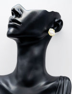 Everyday luxury fashion jewelry gold tone statement studs by Biya Accessoires Dubai.