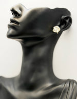 Everyday luxury fashion jewelry gold tone pearl floral studs by Biya Accessoires Dubai.