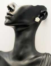 Everyday luxury fashion jewelry gold tone pearl floral studs by Biya Accessoires Dubai.