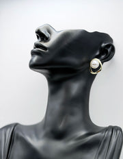 Everyday luxury fashion jewelry gold tone statement studs by Biya Accessoires Dubai.