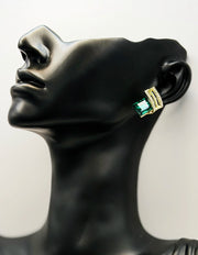 Everyday luxury fashion jewelry gold tone statement studs by Biya Accessoires Dubai.