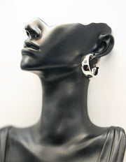Modern minimalist chunky hoops in silver finishes.