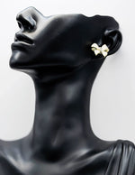 Close-up of premium hypoallergenic imitation jewelry featuring a crystal pavé bow.