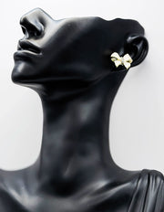 Close-up of premium hypoallergenic imitation jewelry featuring a crystal pavé bow.
