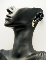 Best imitation jewellery brands in uae geometric open heart gold earrings with crystals.