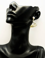 Close up of imitation jewelry uae statement crawlers featuring clear pavé stones.