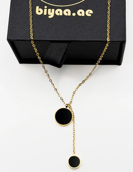 Close-up of premium hypoallergenic imitation jewelry featuring a geometric lariat design.