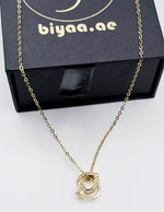 Close-up of premium hypoallergenic imitation jewelry featuring intertwined eternity circles.