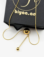 Close-up of premium hypoallergenic imitation jewelry featuring a sliding sphere design.
