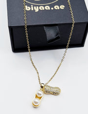 Close-up of premium hypoallergenic imitation jewelry featuring a quirky pearl pendant.