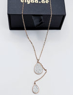 Model wearing an elegant rose gold lariat drop necklace in the UAE.