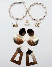 Biya Accessoires 6-pair gold earring set with textured geometric drops and pearls.